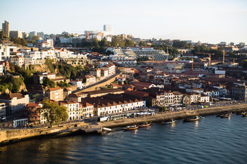 View of Douro river and the promenade of Vila Nova de Gaia in the historic center of Porto, Portugal.