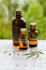 Cannabis oil or CBD oil cannabis extract, Hemp oil. Premium marijuana products. Medical marijuana cannabis cbd oil in a bottles with marijuana leaf.  Copy space