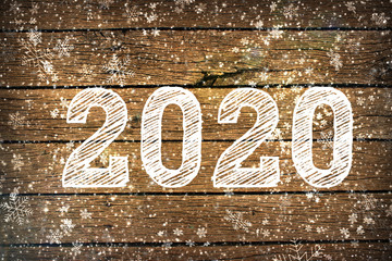 2020. Texture dark wood ilfri 2020.New year background. Retro wooden table. Rustic background. White snowflakes , snow, bokeh. Copy space.Background Christmas, new year.Dark wood texture with white sn