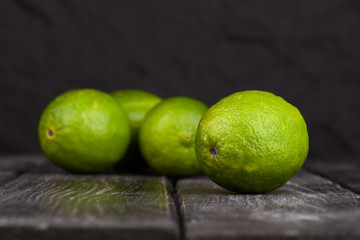 lime juice with lime slices on wooden table. Detox diet