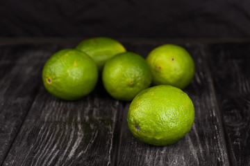 lime juice with lime slices on wooden table. Detox diet