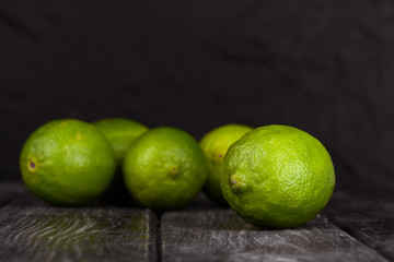lime juice with lime slices on wooden table. Detox diet