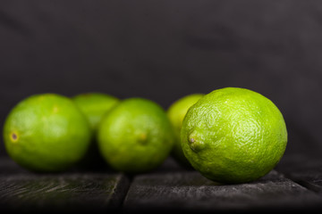 lime juice with lime slices on wooden table. Detox diet