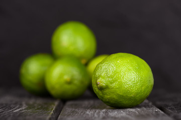 lime juice with lime slices on wooden table. Detox diet