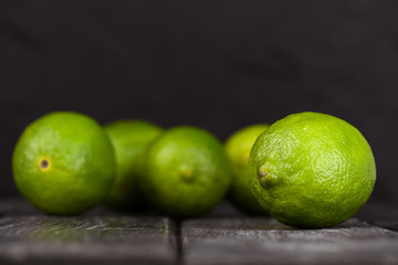 lime juice with lime slices on wooden table. Detox diet