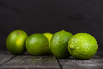 lime juice with lime slices on wooden table. Detox diet