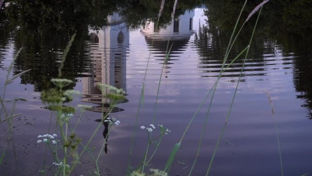 reflection of a temple in a river or lake. slow motion 50p
