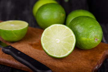 lime juice with lime slices on wooden table. Detox diet