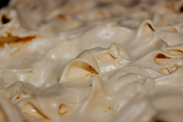 Plate with tasty meringue pie. closeup