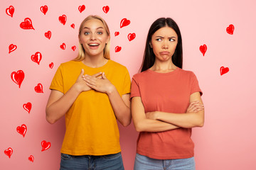 Friends receives likes and hearts from social network. But the blonde is happy and the brunette is...