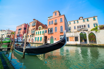 Fototapeta na wymiar gondona on water channel in Venice