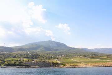 Clouds over the mountain shore.