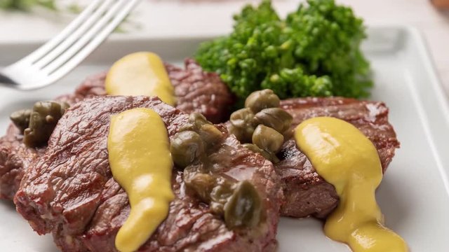 Steamy filet mignon with caper and mustard sauce