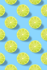 Fototapeta premium Vivid fruit pattern of fresh lime on colourful background