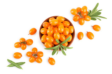 Sea buckthorn in wooden bowl. Fresh ripe berry with leaves isolated on white background with copy space for your text. Top view. Flat lay pattern