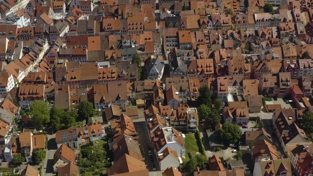 Aerial view of the city Villingen-Schweningen in Germany in the black forest on a sunny day in summer. Pan to the right along the old town.