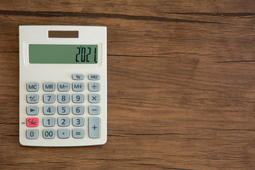 Calculator on wooden background