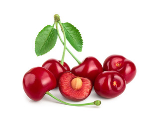 Some cherries with leaf and cut closeup isolated on white background