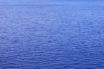 Background. The surface of the water is blue.