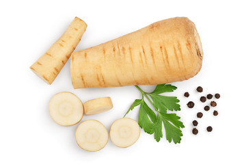 Parsnip root and slices with parsley peppercorns isolated on white background closeup. Top view....