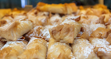 Delicious portuguese pastry. Cake with puff pastry, sweet egg and sugar powder