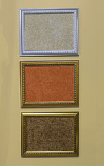 Fototapeta premium Picture frames on yellow wall