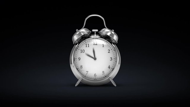 Twin bell alarm clock measuring time, clock hands moving too quickly causing malfunction and breaking the clock into small pieces.