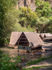 Fototapeta na wymiar wooden hut structures on a river