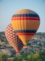 hot air balloon tours rising over cappadocia