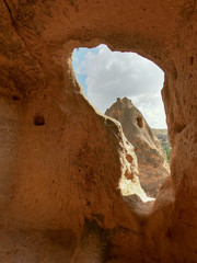 ancient window carved into sandstone caves