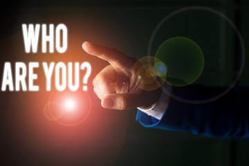 Word writing text Who Are You Question. Business photo showcasing asking about someone identity or demonstratingal information Isolated hand pointing with finger. Business concept pointing finger