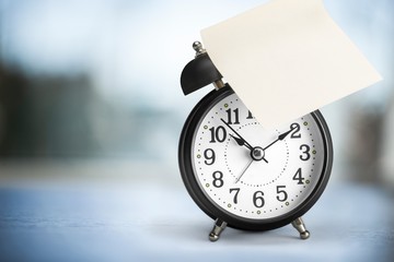 Retro alarm clock on background