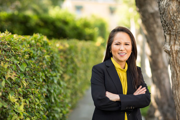 Portrait of a mature Asian woman in a business suit.