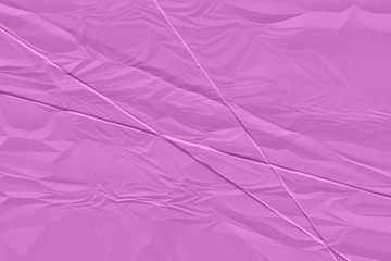 Naklejka premium crumpled pink paper background close up