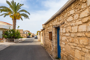 Fototapeta na wymiar Pathos. Cyprus. The streets of Paphos. One-story streets of the city. Travels in Cyprus. Holidays on the shores of the Mediterranean Sea. Walking in the streets of Cyprus. Mediterranean coast.