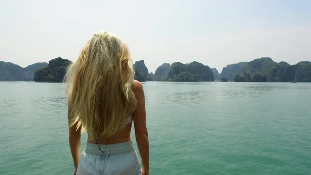 Wide Angle: Woman Looking Out to the Islands in the Water of Halong Bay