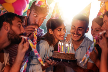 Group of friends celebrating birthday together - Powered by Adobe