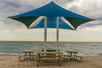 Public beach shelter and benches at Pickering waterfront, Ontario, Canada