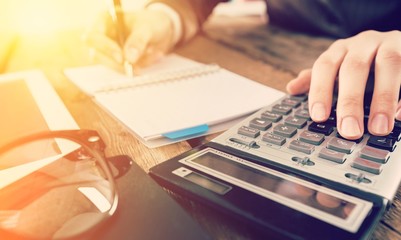 Accountant man  with calculator and documents