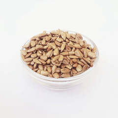 Sunflower seeds heap in a bowl. isolated photo white background