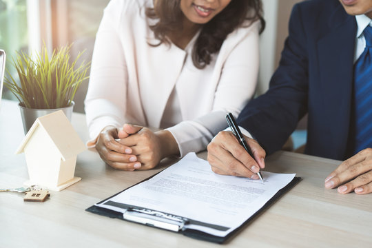 Tenants Signing Rental Contract With Realtor.