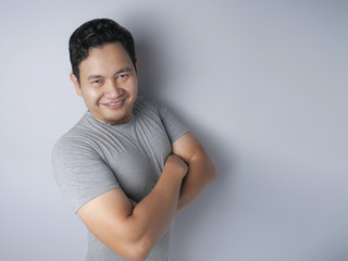 Young Funny Asian Man Smiling Happily