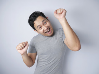 Fototapeta premium Happy Funny Asian Man Dancing Full of Joy