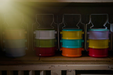 Colorful tiffin in the cabinet in the pedestrian market