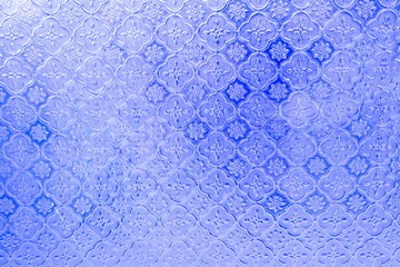 The background image is made of various colored glass windows.