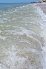 Close up of an ocean wave on the beach