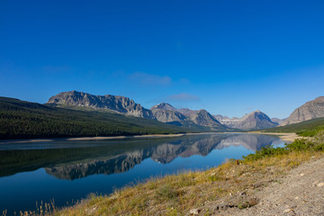 Morning view of the Wynn Mountain with reflection and Lake Sherburne