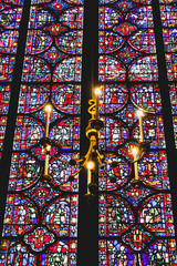 Chandelier and stained glass in a church of Paris in France