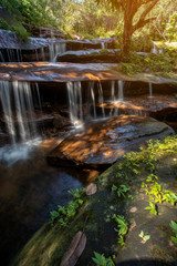 Fototapeta premium soft water of the stream in the WIMAN THIP Waterfall natural park, Beautiful waterfall in rain forest