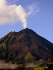 Arenal volcano in Costa Rica with a cloud plume